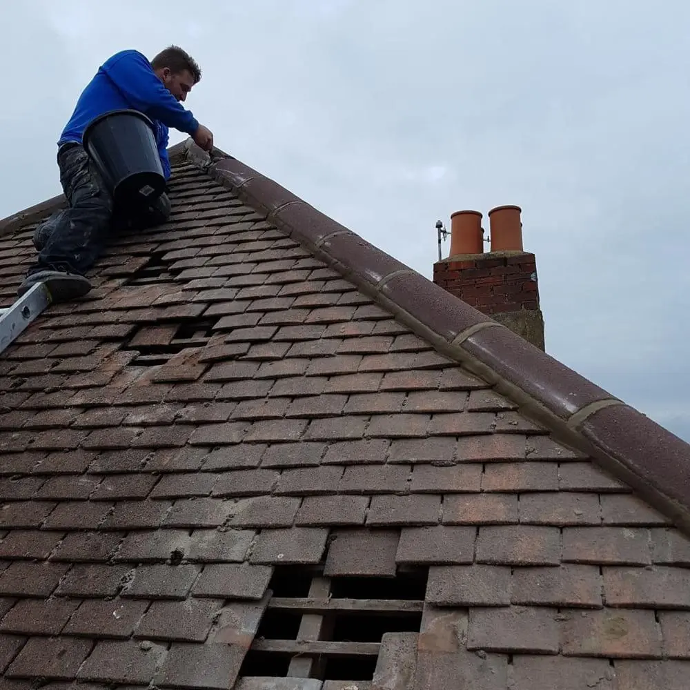 emergency roof repair London team protecting an NW2 loft conversion roof with rubber sheeting