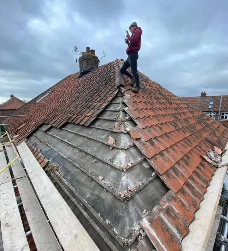 emergency roof repair London van arriving to cover a storm-damaged roof