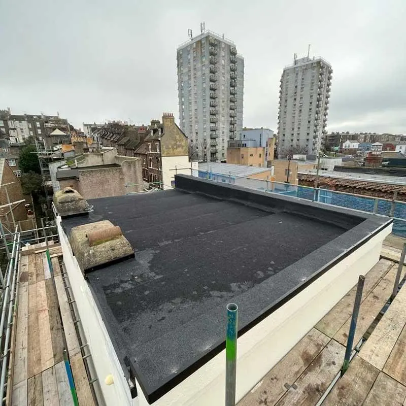 flat roof repair London team using a drone to inspect a home roof